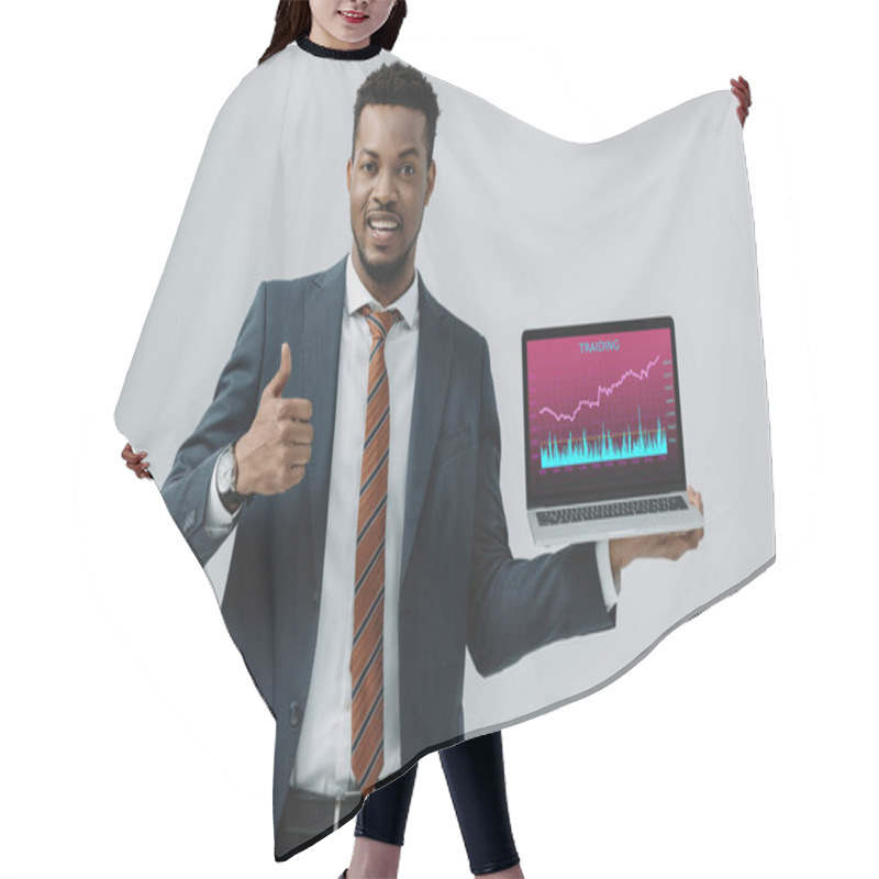 Personality  Cheerful African American Man Holding Laptop With Trading Analyzing  On Screen And Showing Thumb Up Isolated On Grey  Hair Cutting Cape