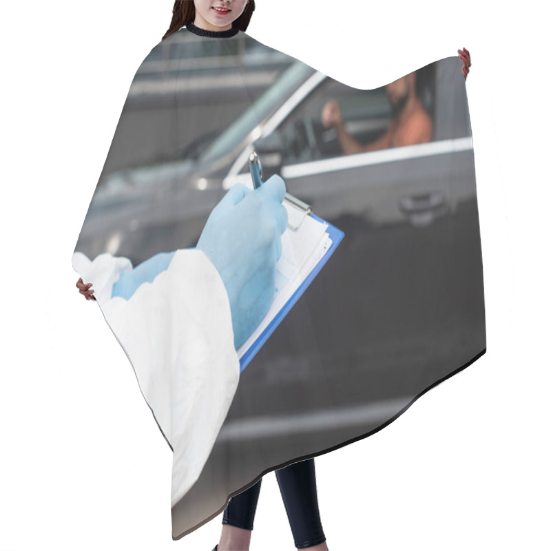 Personality  Medical Worker Writing On Clipboard Near Blurred Driver In Car  Hair Cutting Cape