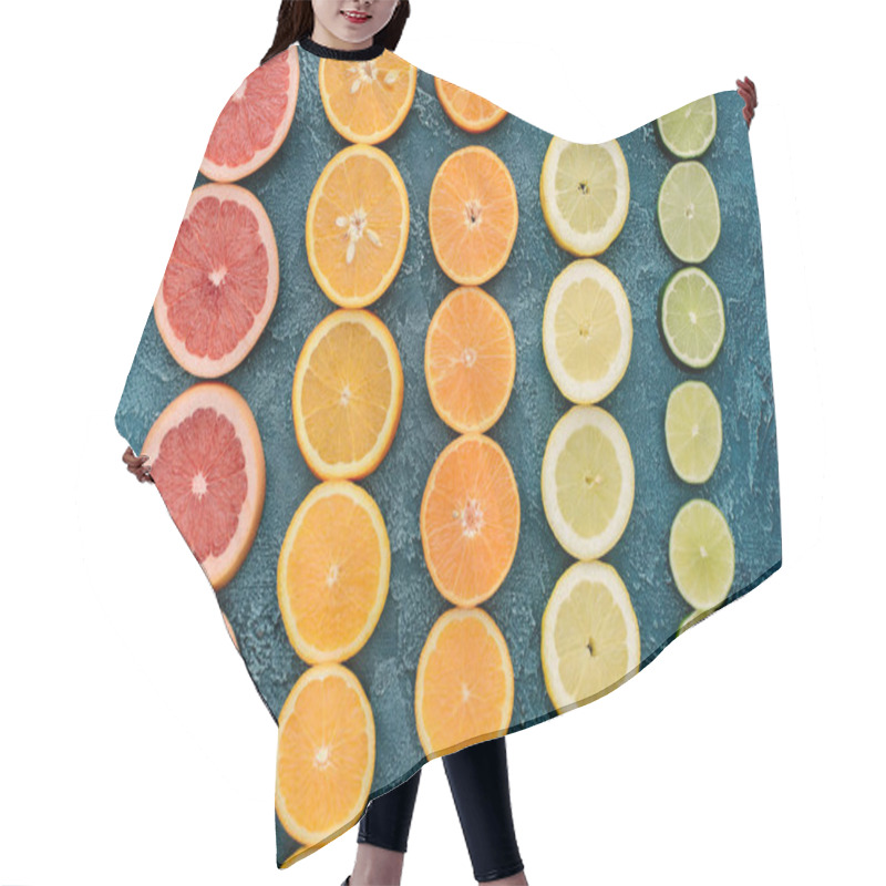 Personality  Top View Of Citrus Fruits Slices In Rows On Blue Concrete Surface Hair Cutting Cape