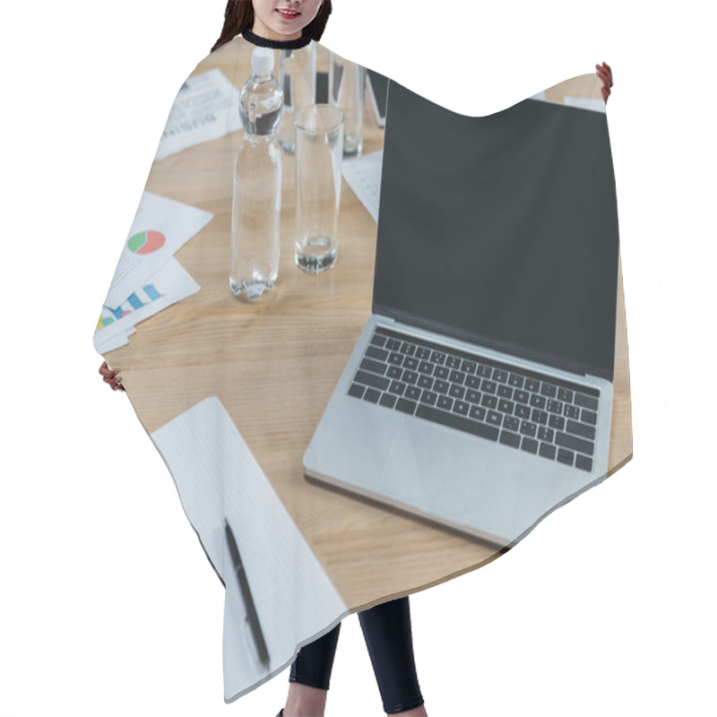 Personality  Laptop With Blank Screen, Empty Notebook, Papers With Infographics, Bottle And Glass Of Water On Wooden Table In Meeting Room Hair Cutting Cape