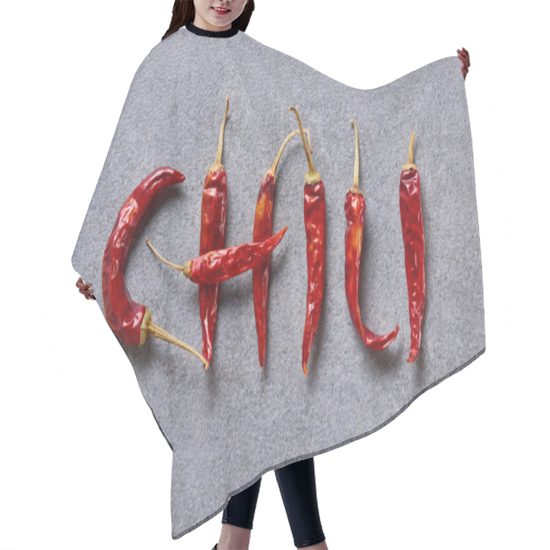 Personality  Top View Of Dried Chili Peppers Arranged In Chili Lettering On Grey Tabletop Hair Cutting Cape