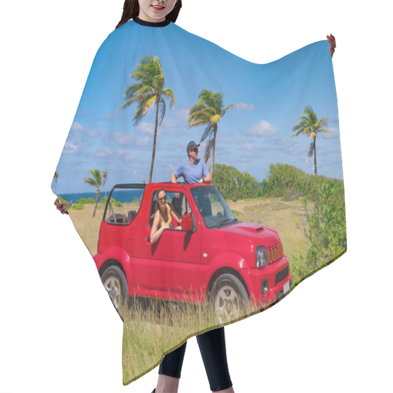 Personality  Cheerful Tourist Couple Poses In Their Red Jeep While Exploring Tropical Island. Hair Cutting Cape