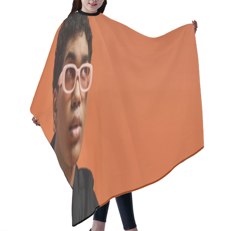 Personality  Handsome African American Man In Pink Glasses Against Orange Backdrop. Hair Cutting Cape