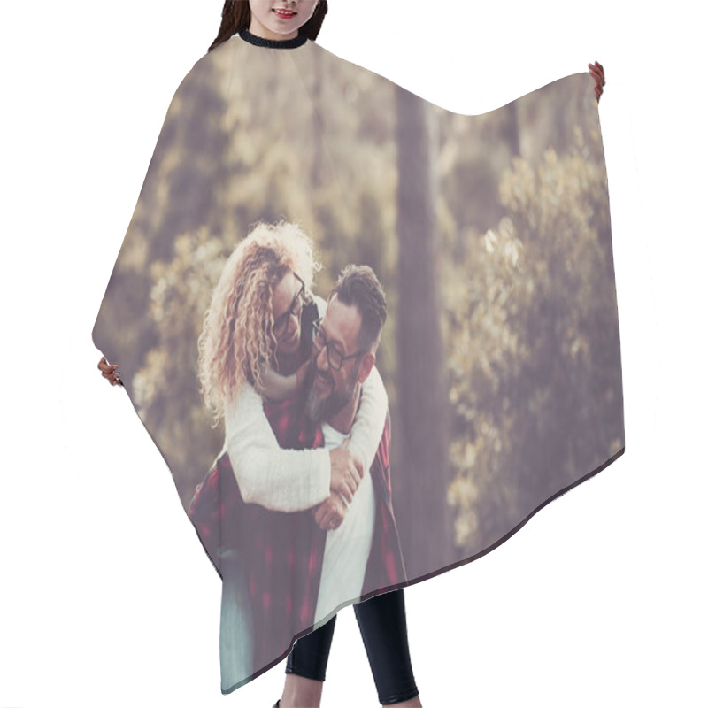 Personality  Happy Adult Caucasian Couple In Relationship And Love Play Together In The Forest Wood Nature  Hair Cutting Cape