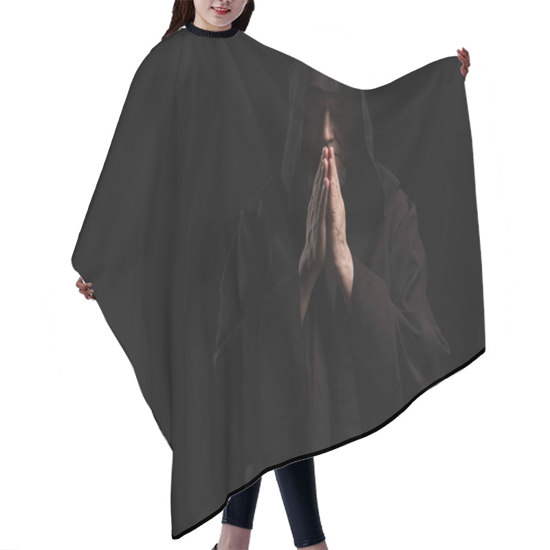 Personality  Front View Of Mysterious Monk In Hooded Cassock Praying Isolated On Black Hair Cutting Cape