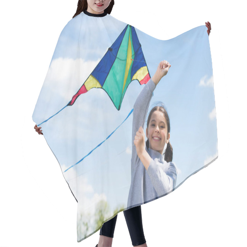 Personality  Low Angle View Of Smiling Child Holding Kite In Park Hair Cutting Cape