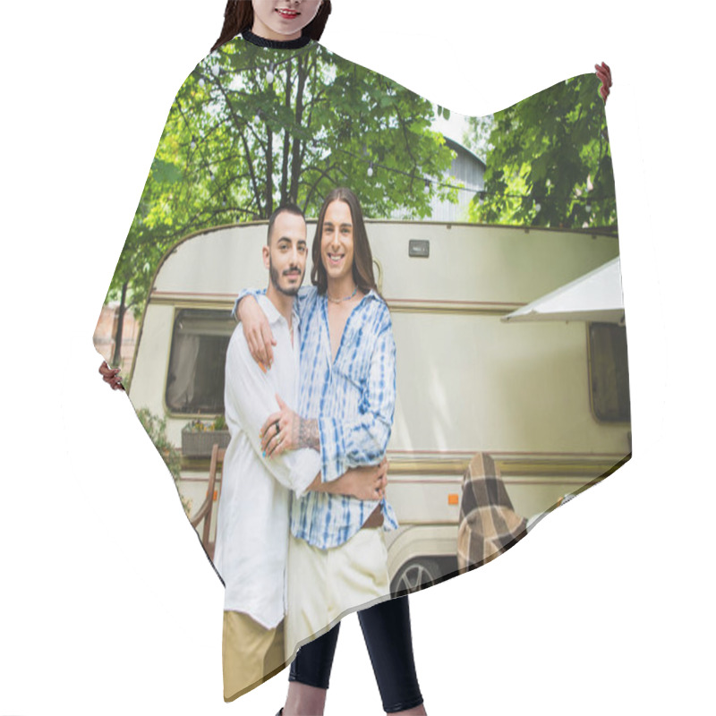 Personality  Happy Gay Couple Smiling While Hugging Near Travel Van In Forest  Hair Cutting Cape