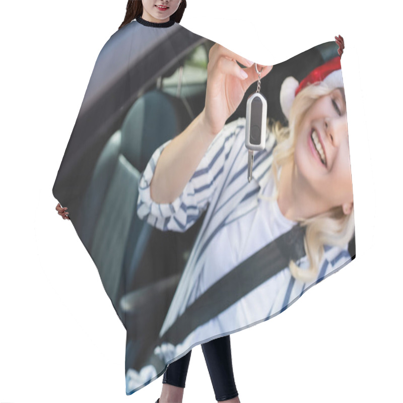 Personality  Blurred Cheerful Woman In Santa Hat Holding Key In Car  Hair Cutting Cape