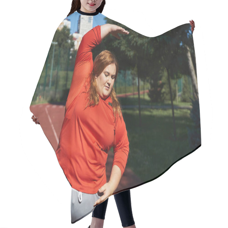 Personality  A Plus Size Woman Performs A Stretching Exercise Outdoors In The Park. Hair Cutting Cape