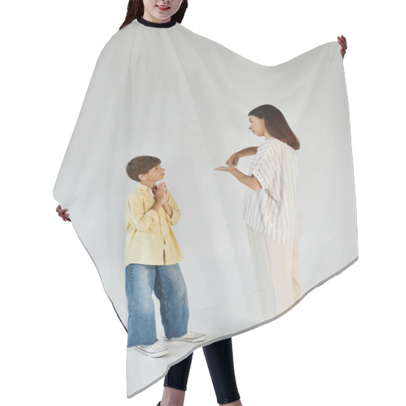 Personality  A Caring Mother Engages With Her Hearing Impaired Son, Fostering Communication And Connection. Hair Cutting Cape