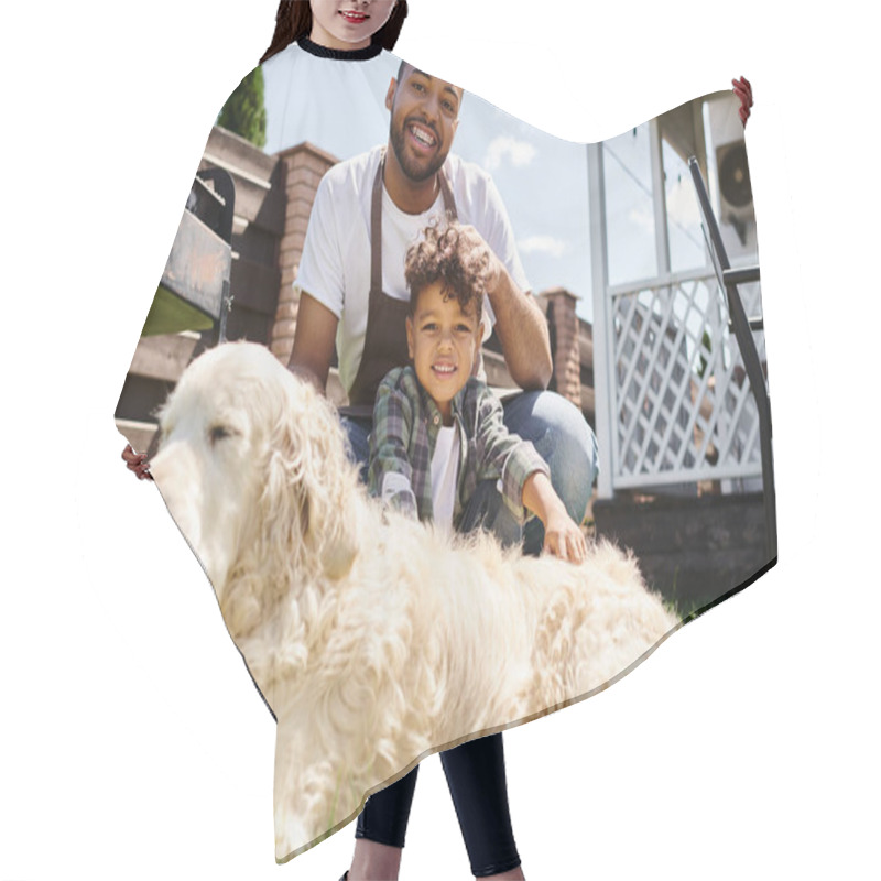 Personality  Happy African American Man In Apron Touching Curly Hair Of Son And Sitting Near Family Dog Outdoors Hair Cutting Cape