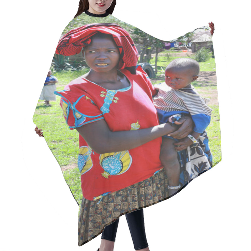 Personality  Black Woman In Shabby Clothes, Holds A Child. Hair Cutting Cape