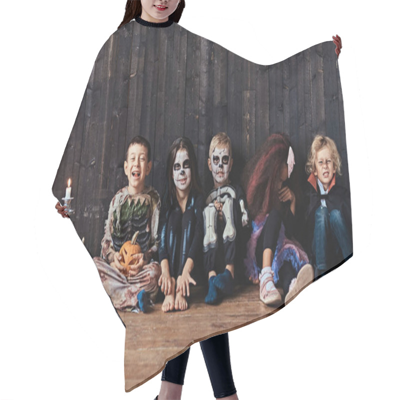 Personality  Halloween Party With Group Children Who Sitting Together On A Wooden Floor In An Old House. Halloween Concept. Hair Cutting Cape