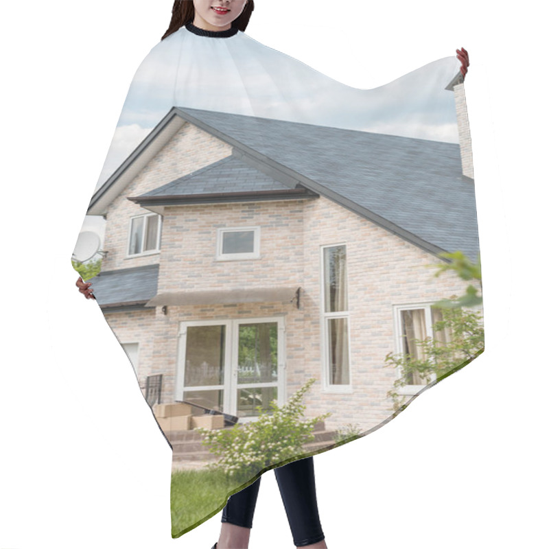 Personality  Front View Of Cardboard Boxes, Soccer Ball And Guitar For Relocation In Front Of Modern Cottage  Hair Cutting Cape