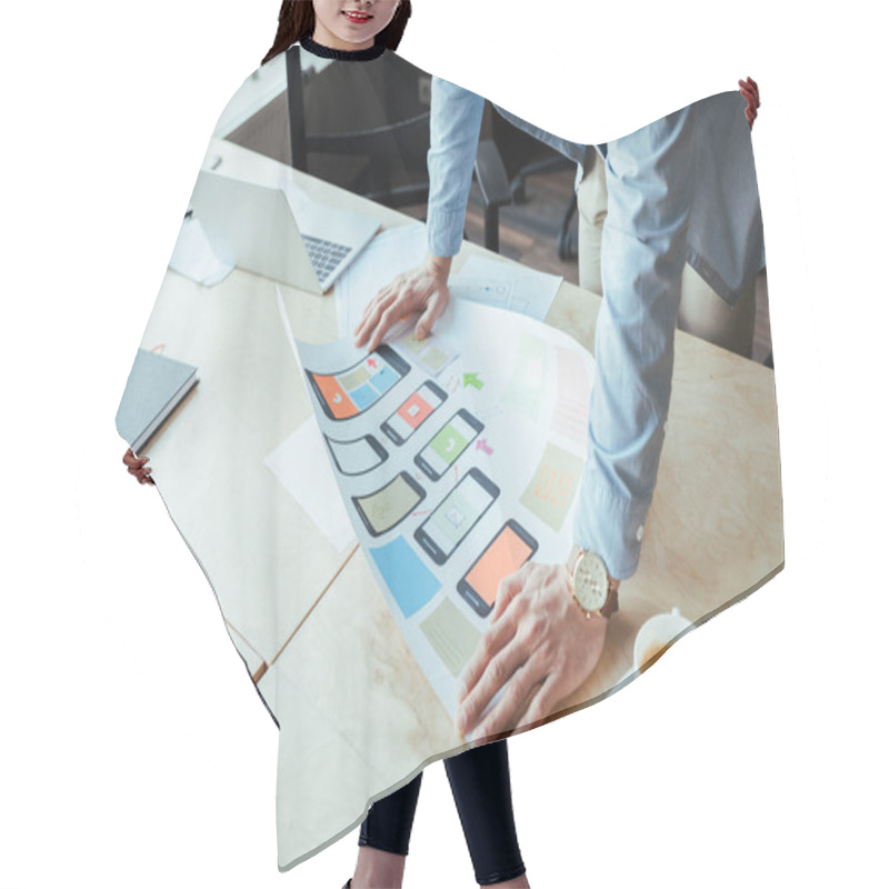 Personality  Cropped View Of UI Designer With Wove Paper Near Cup Of Coffee At Table In Coworking Space Hair Cutting Cape