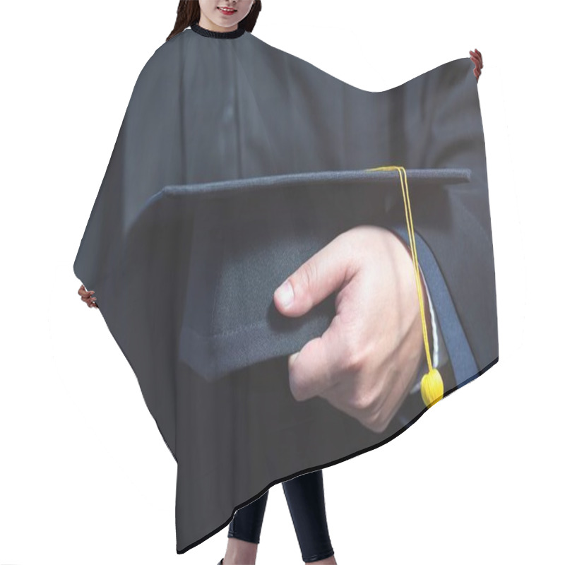 Personality  Close Up Of Graduation Cap With Yellow Tassel In Hand. Hair Cutting Cape