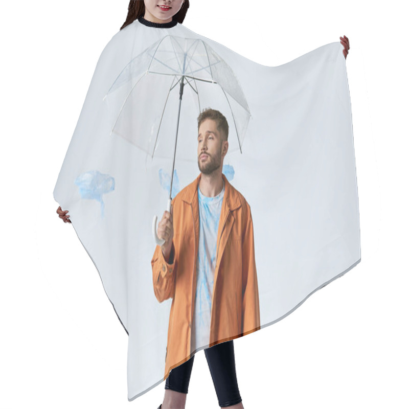 Personality  A Man Holds A Clear Umbrella As He Stands Surrounded By Plastic Shapes. Hair Cutting Cape