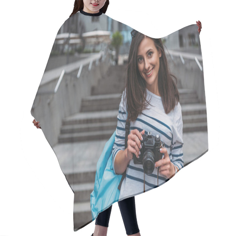 Personality  Woman In Casual With Backpack Holding Digital Camera And Smiling Hair Cutting Cape