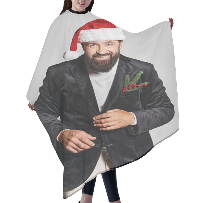 Personality  Portrait Of Bearded Handsome Man In Elegant Suit And Santa Hat Posing On Grey Backdrop, Christmas Hair Cutting Cape