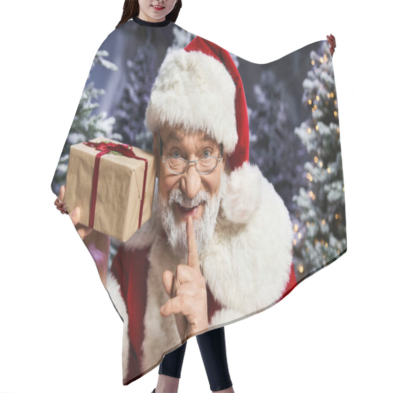 Personality  A Joyful Santa Claus With A Wrapped Gift Brings Holiday Cheer Amidst Winter Trees. Hair Cutting Cape