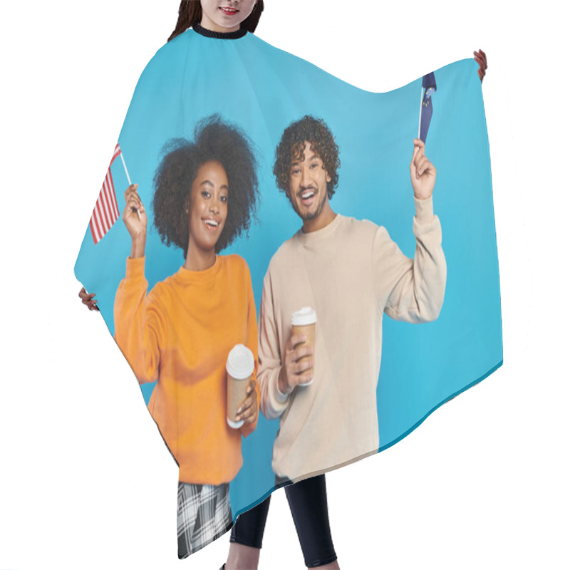 Personality  An Interracial Couple, Dressed Casually, Proudly Hold American Flags Against A Blue Backdrop. Hair Cutting Cape