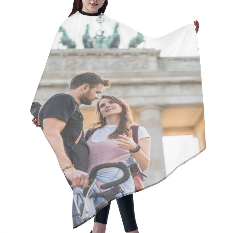 Personality  Low Angle View Of Woman Talking To Boyfriend With Bicycle In Front Of Brandenburg Gate In Berlin, Germany  Hair Cutting Cape