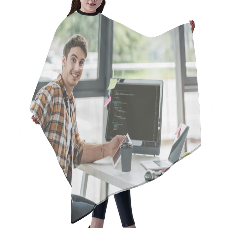 Personality  Cheerful Programmer Smiling At Camera While Sitting Near Computer Monitor With Script On Screen Hair Cutting Cape