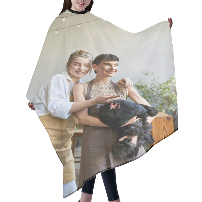 Personality  Two Women, In An Art Studio, Tenderly Holding A Chicken. Hair Cutting Cape