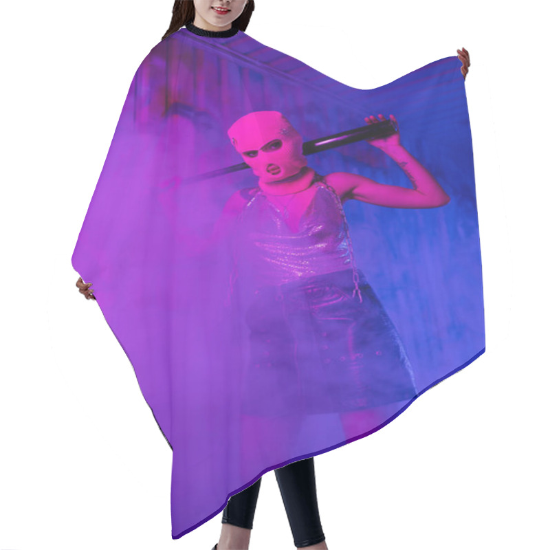 Personality  Provocative Woman In Balaclava And Black Leather Skirt Standing With Baseball Bat In Purple Lighting With Smoke Hair Cutting Cape