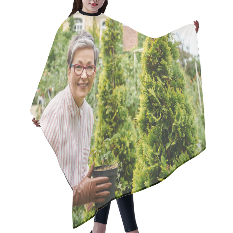 Personality  Joyful Mature Woman Taking Care Of Plant In Pot In Her Garden In England And Smiling At Camera Hair Cutting Cape