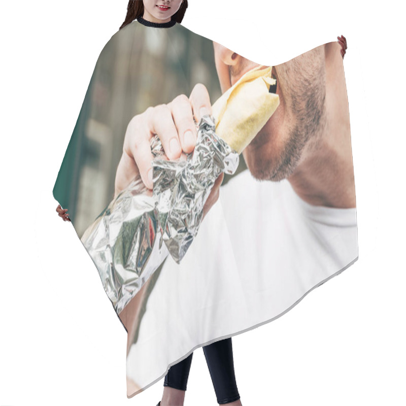 Personality  Cropped View Of Man Eating Doner Kebab In Aluminium Foil Hair Cutting Cape