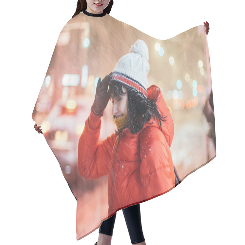 Personality  Young Adult Woman On City Street Uder Winter Snow Storm At Night Time. Hair Cutting Cape