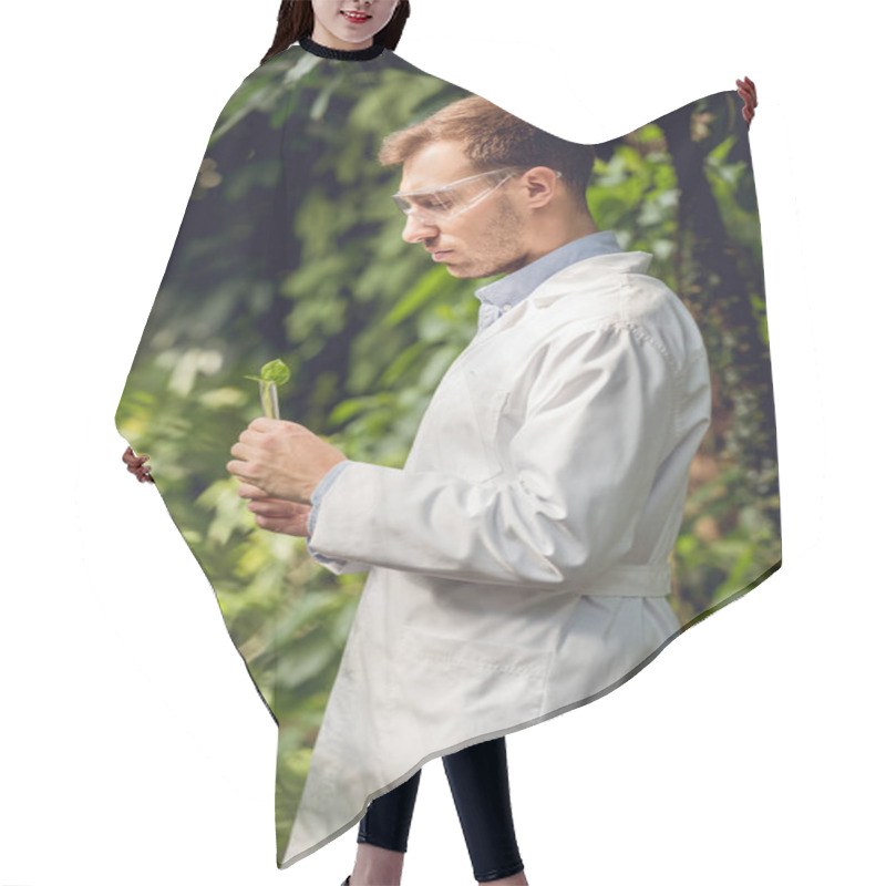 Personality  Handsome Scientist In White Coat And Goggles Examining Plants In Orangery Hair Cutting Cape