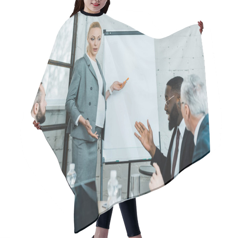 Personality  Pregnant Blonde Business Coach Standing Near White Board And Gesturing In Conference Room  Hair Cutting Cape