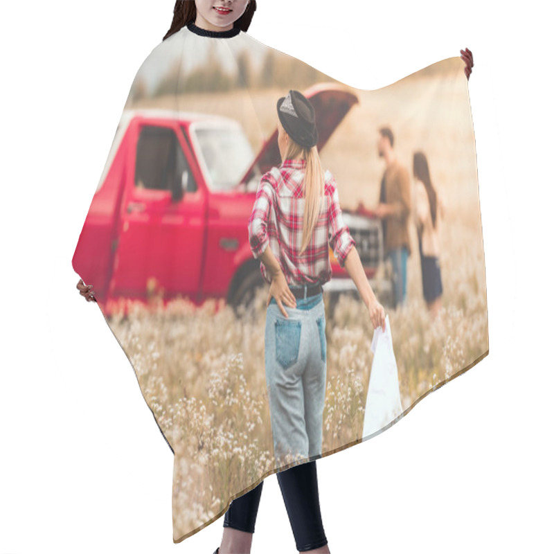 Personality  Rear View Of Young Woman With Map Walking At Broken Car In Flower Field While Her Friends Standing On Background Hair Cutting Cape