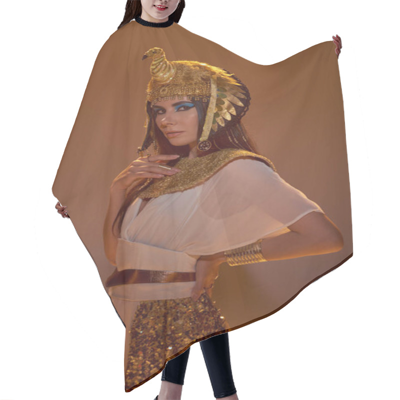 Personality  Elegant Woman In Egyptian Look And Headdress Looking At Camera On Brown Background Hair Cutting Cape