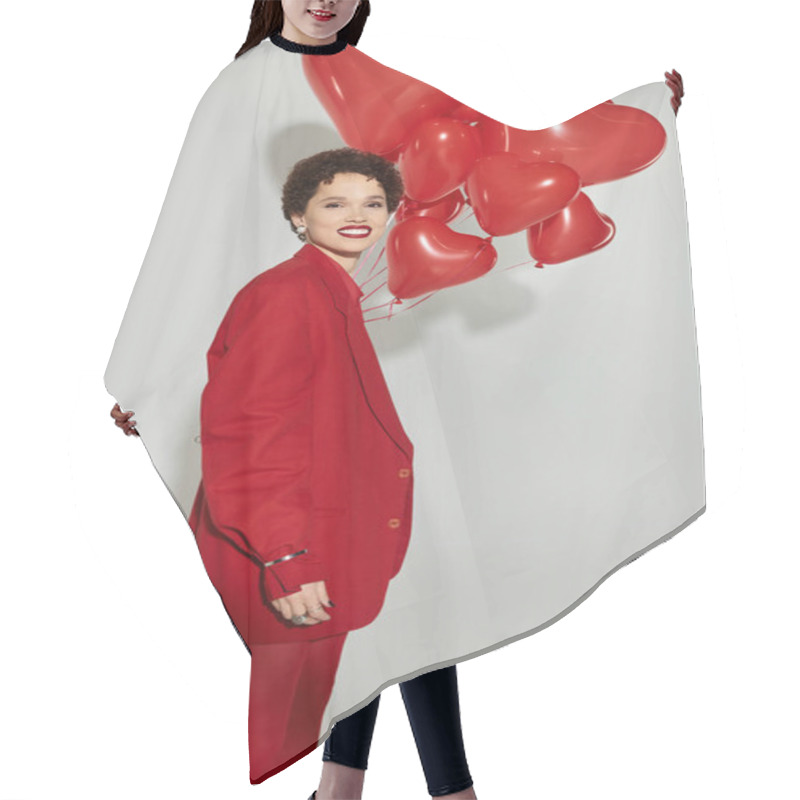 Personality  A Stylish Woman In Red Joyfully Holds Heart Shaped Balloons. Hair Cutting Cape