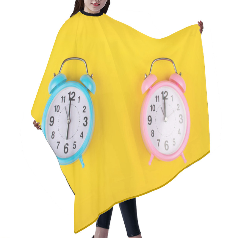 Personality  Two Alarm Clocks On A Bright Yellow Background Showing Different Time As The Concept Of A Morning Person And A Night Owl Hair Cutting Cape