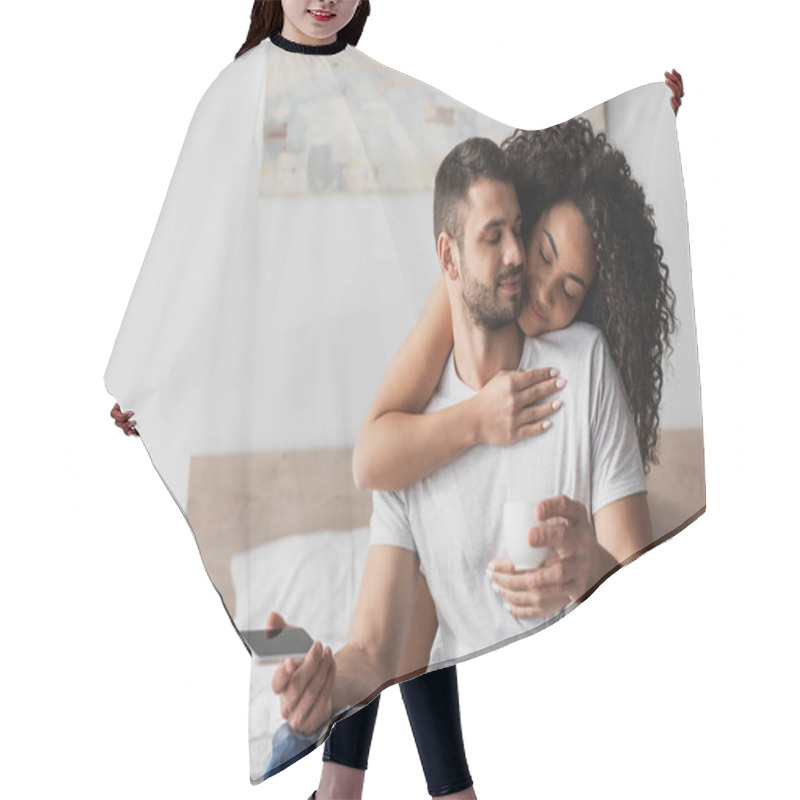 Personality  Happy African American Woman Hugging Bearded Boyfriend With Smartphone And Cup  Hair Cutting Cape