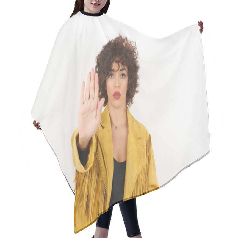 Personality  Young Beautiful Woman Doing Stop Gesture With Palm Of The Hand. Warning Expression With Negative And Serious Gesture On The Face Isolated Over Gray Background. Hair Cutting Cape