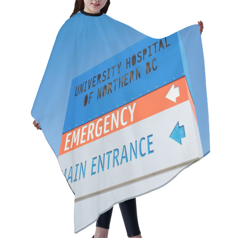 Personality  Prince George, Canada - August 25,2022:University Hospital Of Northern BC Entrance Sign With Emergency And Main Entrance Directional Arrows Against Blue Sky Hair Cutting Cape