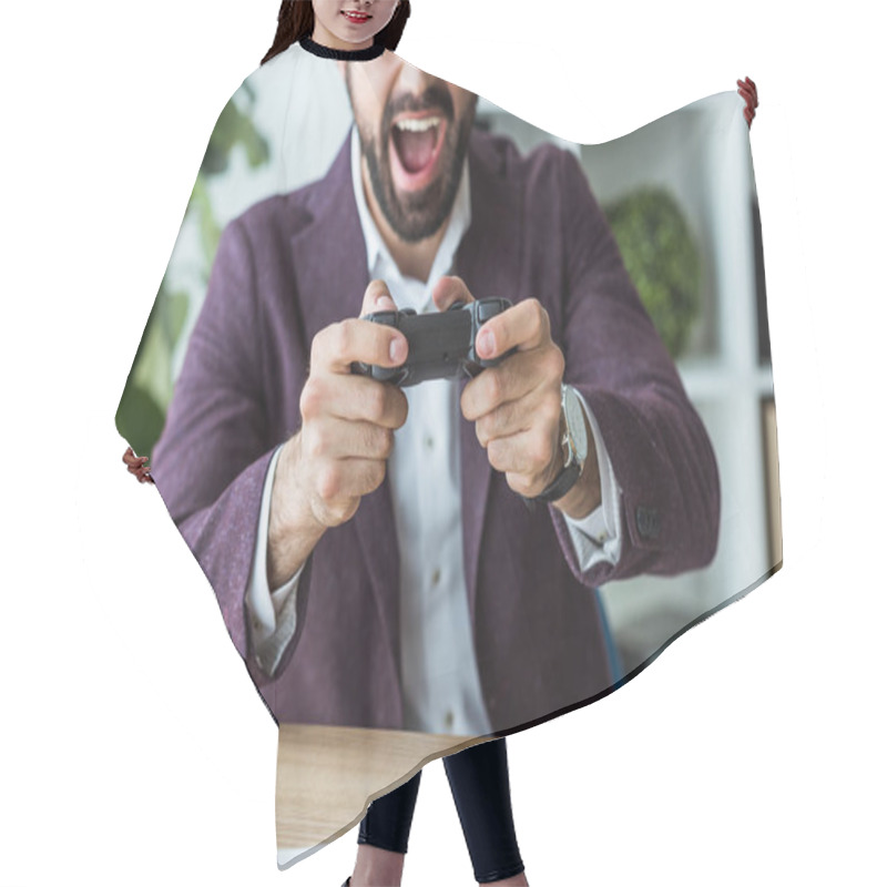 Personality  Cropped Shot Of Shouting Young Businessman Playing Games With Gamepad Hair Cutting Cape