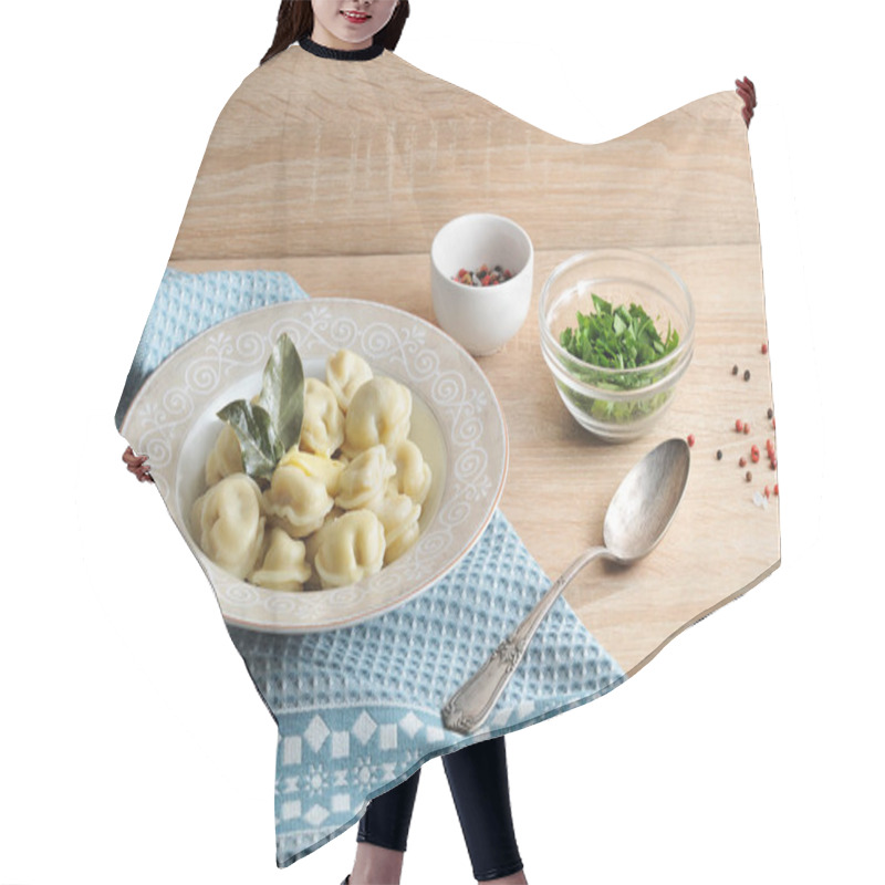 Personality  Homemade Dumplings With A Juicy Filling Of Meat In A Deep Plate. Under The Plate Is A Paper Napkin. Next To The Plate Is A Spoon And Two Bowls With Parsley And Pepper. Light Wooden Background. Hair Cutting Cape