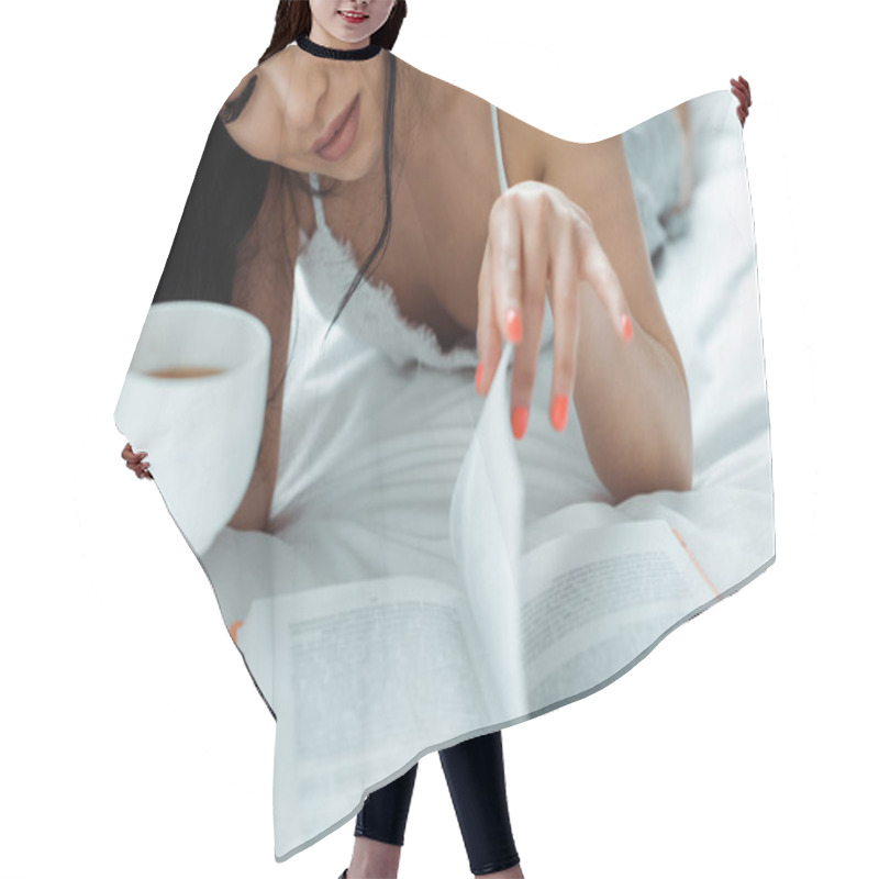 Personality  Cropped View Of Asian Woman Lying On Bed, Reading Book And Holding Cup Of Tea  Hair Cutting Cape