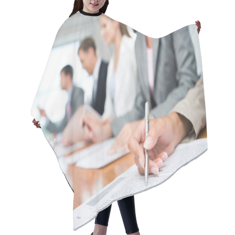 Personality  Woman's Hand With Pen Over Document On Background Of Business Group Hair Cutting Cape