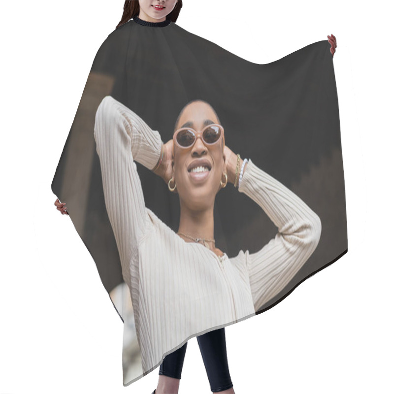 Personality  Low Angle View Of Smiling Short Haired African American Woman In Sunglasses Standing Outdoors  Hair Cutting Cape