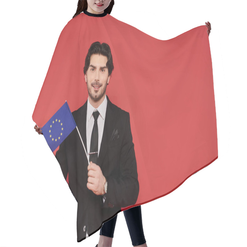 Personality  Young Man Dressed In Formal Attire Displays The EU Flag With A Confident Smile And Dynamic Energy. Hair Cutting Cape