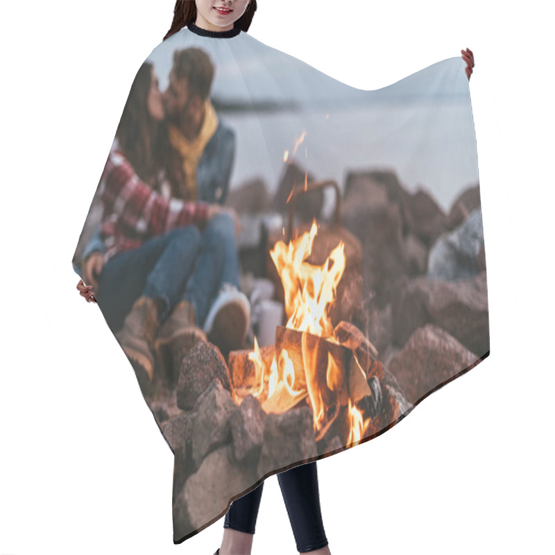 Personality  Selective Focus Of Burning Bonfire Near Couple Kissing And Sitting On Rocks Hair Cutting Cape