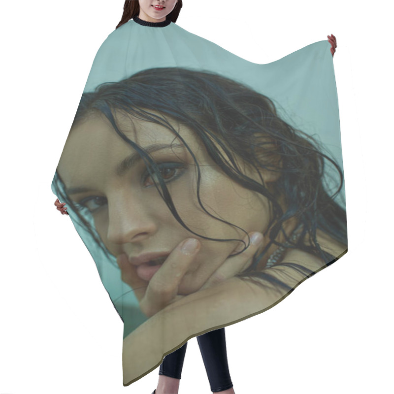 Personality  A Woman With Wet, Dark Hair Poses In A Cool, Aquamarine Setting. Hair Cutting Cape