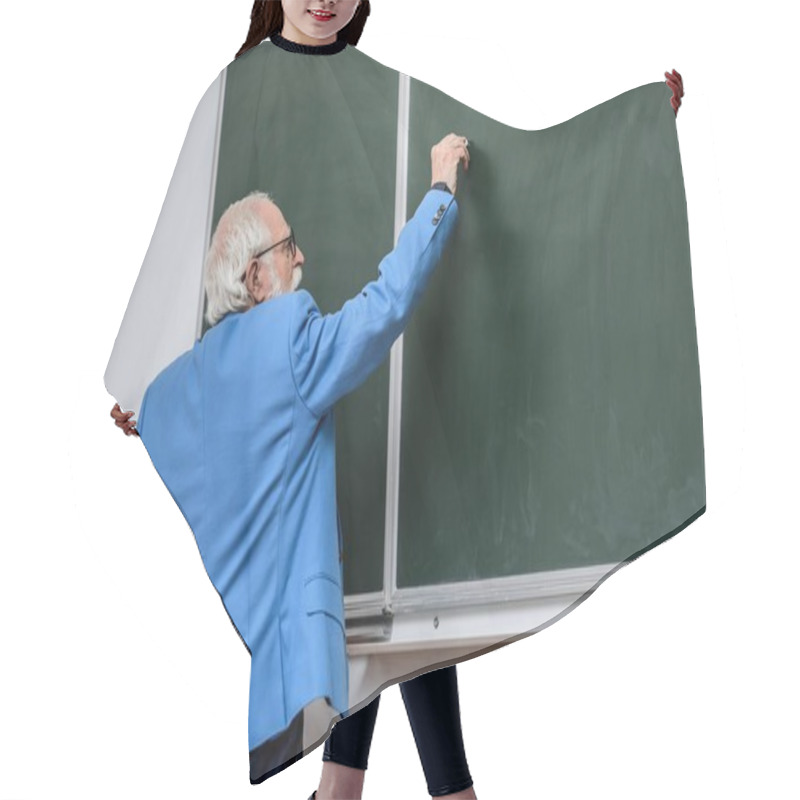 Personality  Rear View Of Senior Lecturer Writing Something On Blackboard With Piece Of Chalk Hair Cutting Cape